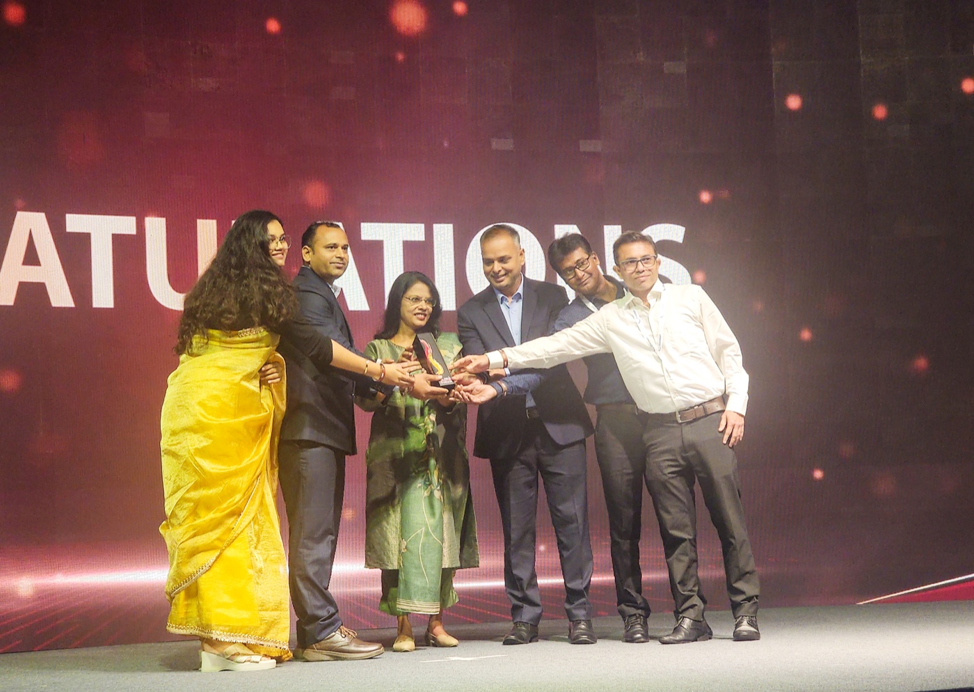 COMCRAFT team receiving Gold at RMAI FLAME Awards Asia 2026
