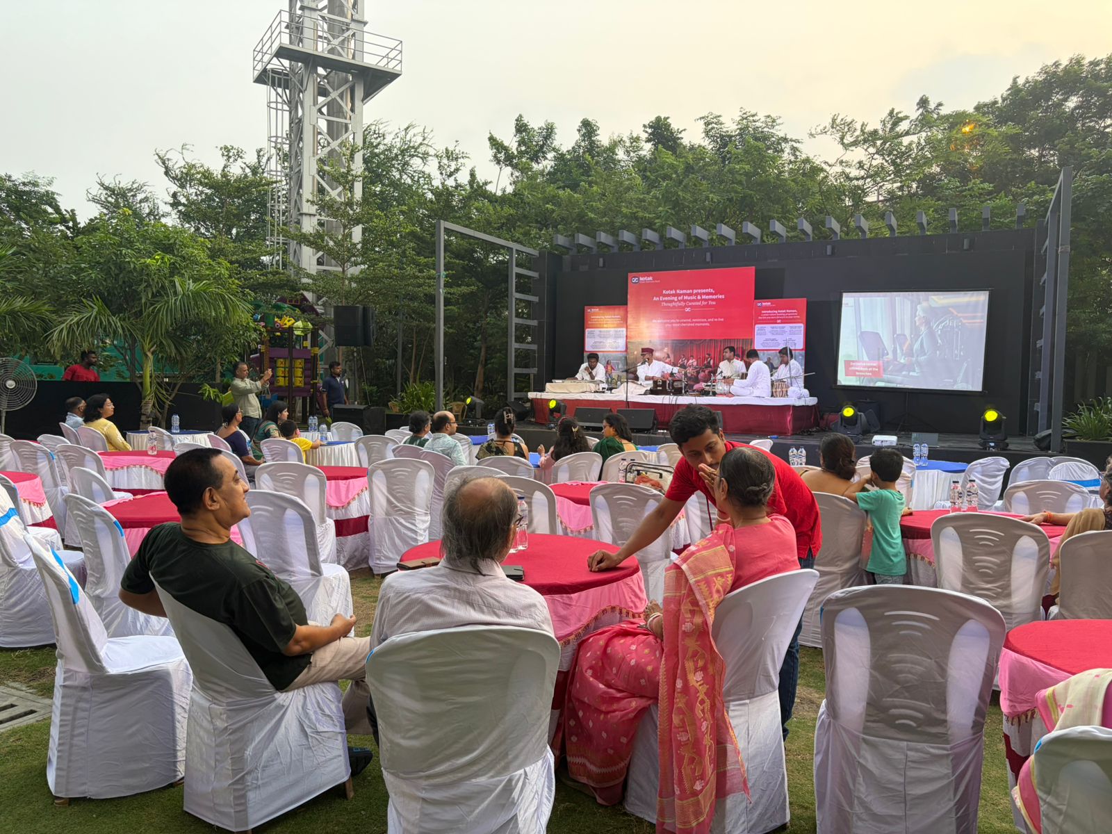 Outdoor Kotak cultural evening — classical music, audience at tables