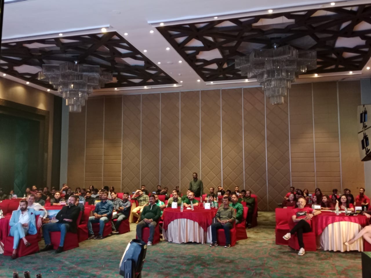 Business meet — full conference hall, presentation in progress