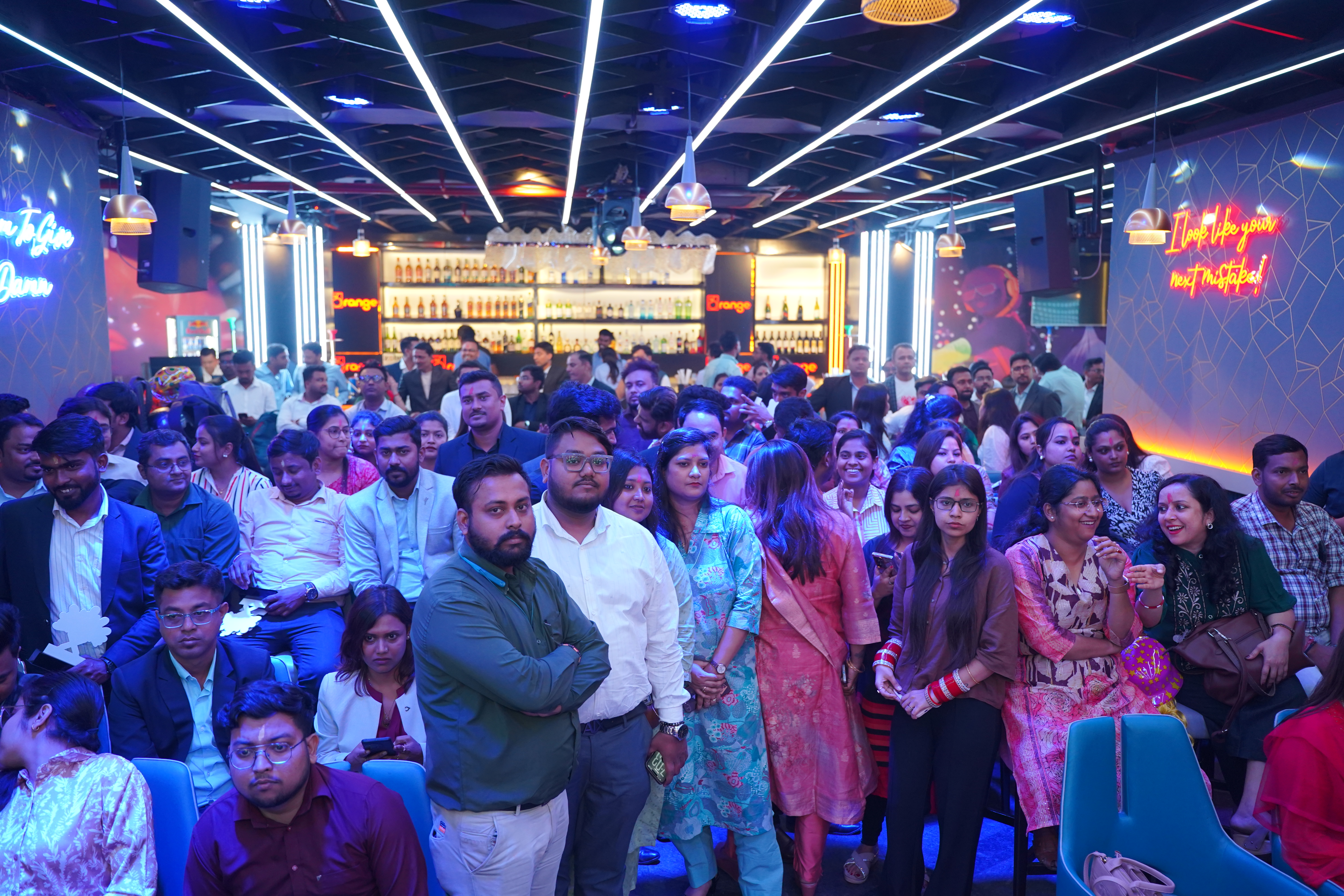 Corporate launch event — packed crowd at branded venue